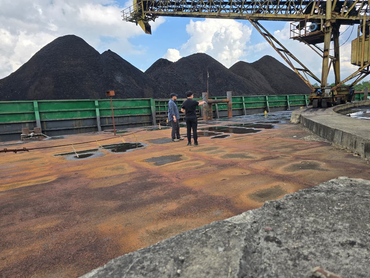 Site team inspecting coal stockpiles at a loading port
