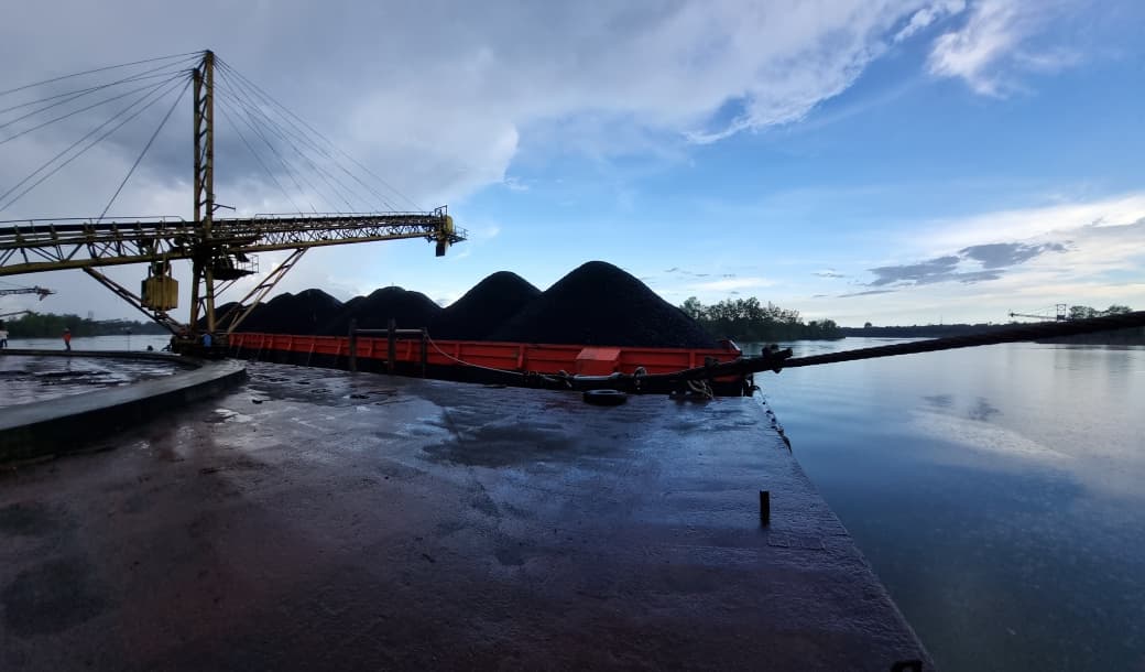 Coal barge at dusk on the river